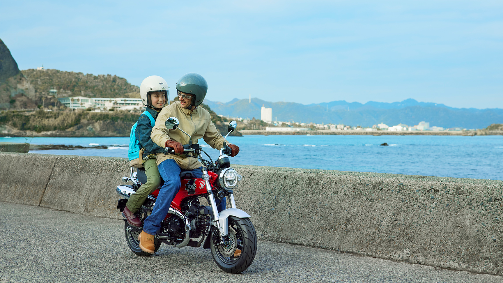 Honda Dax 125 with coastal backdrop